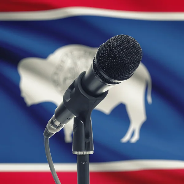 Microphone on stand with US state flag on background - Wyoming — Stock Photo, Image