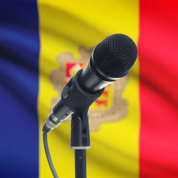 Microphone on stand with national flag on background - Andorra — Stock Photo, Image
