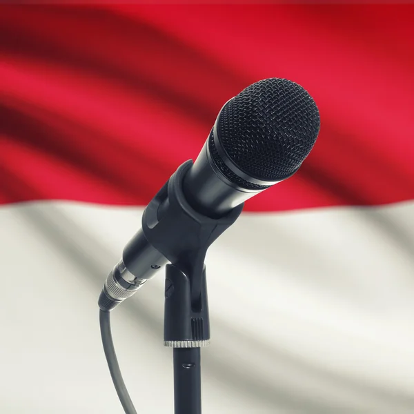Microphone on stand with national flag on background - Indonesia — Stock Photo, Image