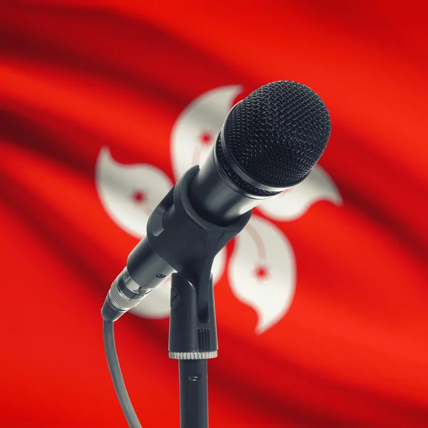 Microphone on stand with national flag on background - Hong Kong — Stock Photo, Image