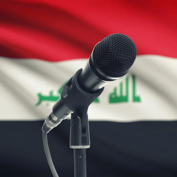 Microphone on stand with national flag on background - Iraq — Stock Photo, Image