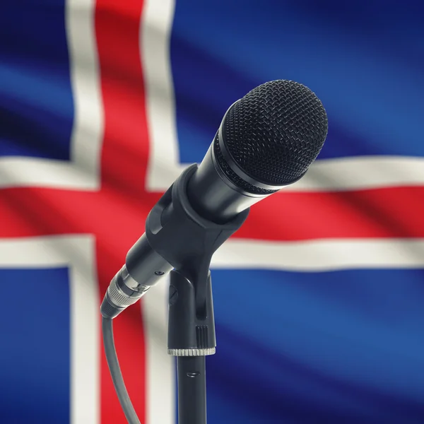 Microphone on stand with national flag on background - Iceland — Stock Photo, Image