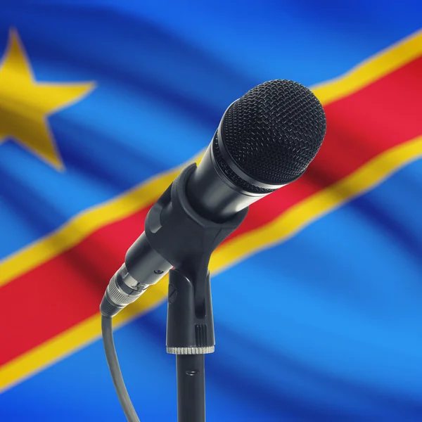 Microphone on stand with national flag on background - Congo-Kin — Stock Photo, Image