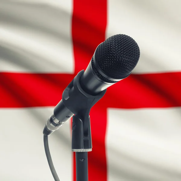 Microphone on stand with national flag on background - England — Stock Photo, Image