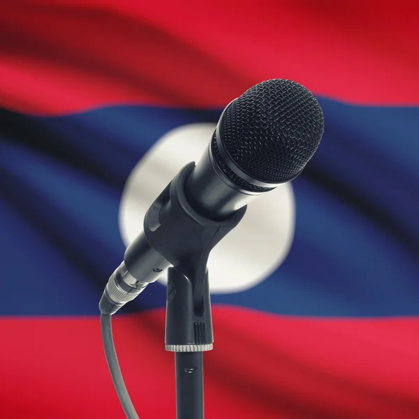 Mikrofon am Stand mit Nationalflagge auf Hintergrund - Laos — Stockfoto