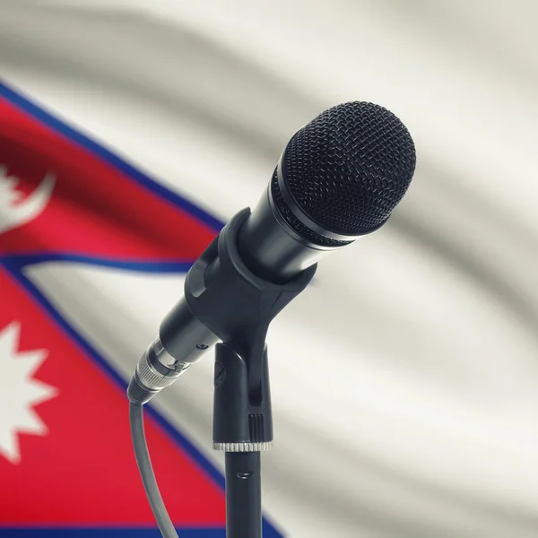 Microphone on stand with national flag on background - Nepal — Stock Photo, Image