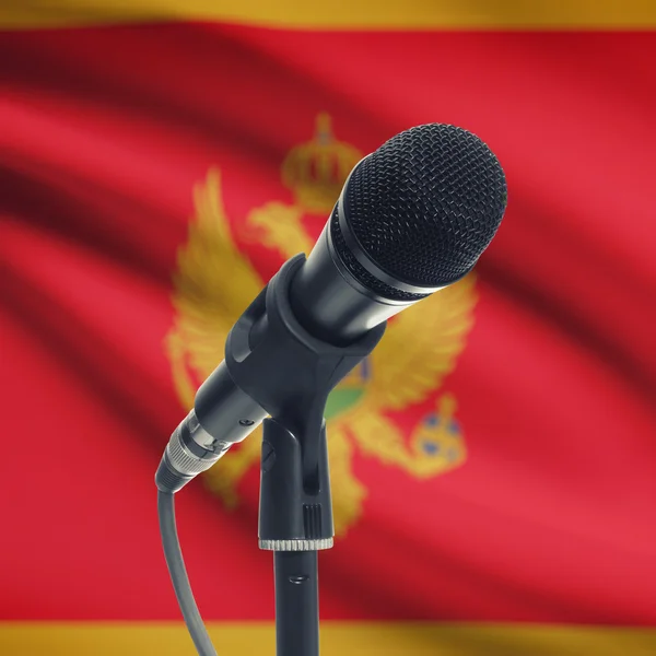 Microphone on stand with national flag on background - Montenegr — Stock Photo, Image