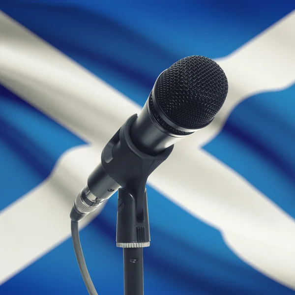 Microphone on stand with national flag on background - Scotland — Stock Photo, Image