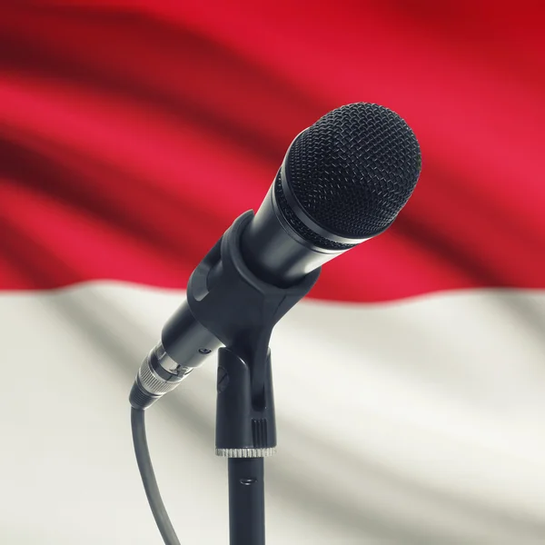 Microphone on stand with national flag on background - Monaco — Stock Photo, Image