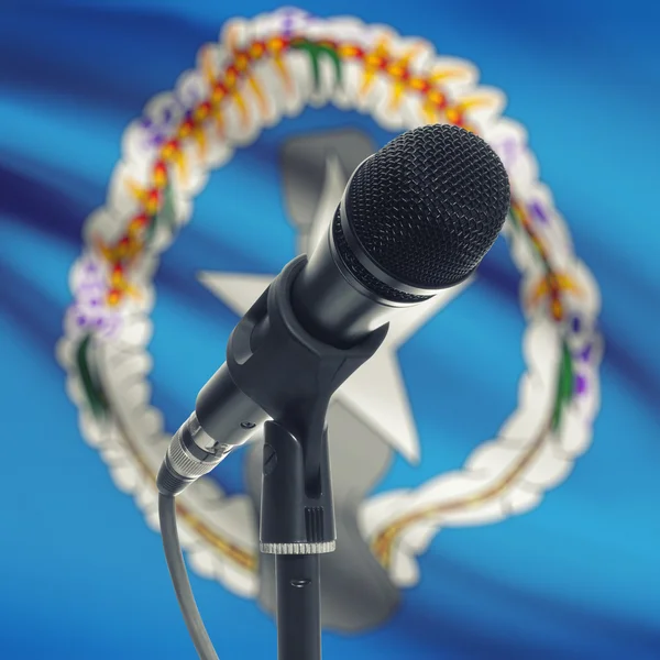 Microphone on stand with national flag on background - Northern — Stockfoto