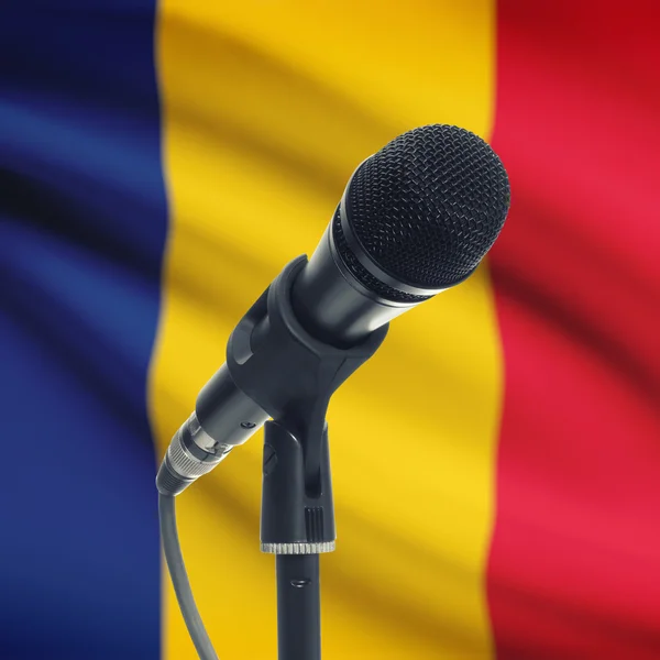 Microphone on stand with national flag on background - Romania — Stock Photo, Image