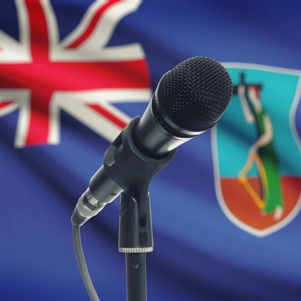 Microphone on stand with national flag on background - Montserra — Stock Photo, Image