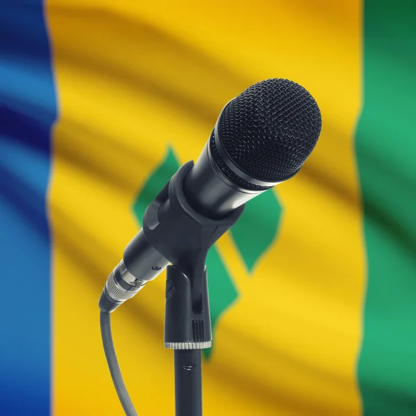 Microphone on stand with national flag on background - Saint Vin — Stock Photo, Image