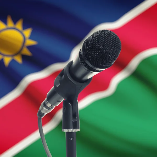 Micrófono en pedestal con bandera nacional de fondo - Namibia — Foto de Stock