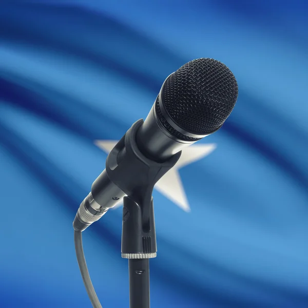 Microphone on stand with national flag on background - Somalia — Stock Photo, Image