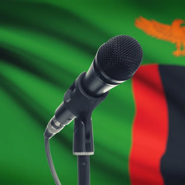 Micrófono en pedestal con bandera nacional de fondo - Zambia —  Fotos de Stock