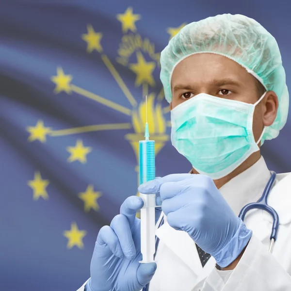 Doctor with syringe in hands and US states flags series - Indiana — Stock Photo, Image