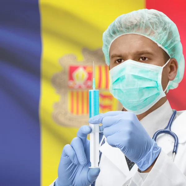 Médico com uma seringa nas mãos e bandeira série - Andorra — Fotografia de Stock