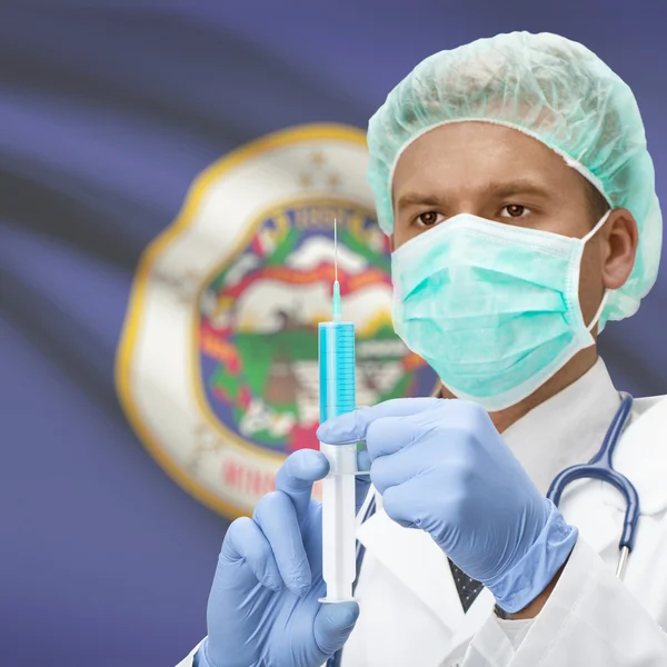 Doctor with syringe in hands and US states flags series - Minnesota — Stock Photo, Image