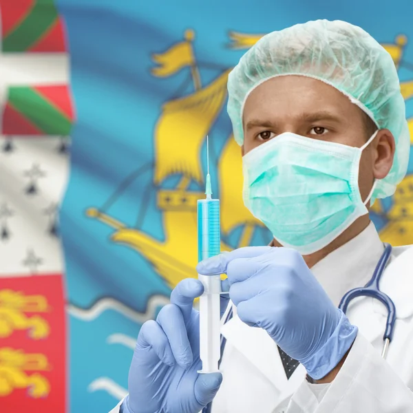 Medico con la siringa in mano e Bandiere - Saint-Pierre e Miquelon — Foto Stock