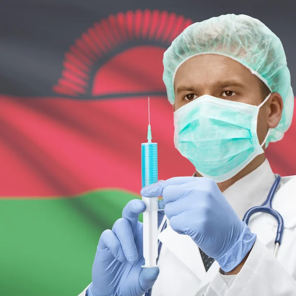 Medico con la siringa in mano e bandiere - Malawi — Foto Stock