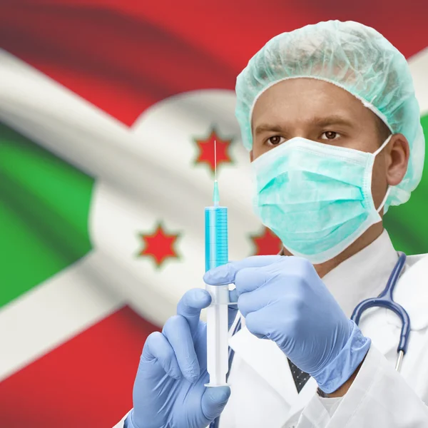 Médecin avec une seringue dans les mains et la série des drapeaux - Burundi — Photo