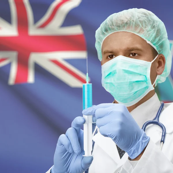 Médecin avec une seringue dans les mains et la série des drapeaux - Montserrat — Photo