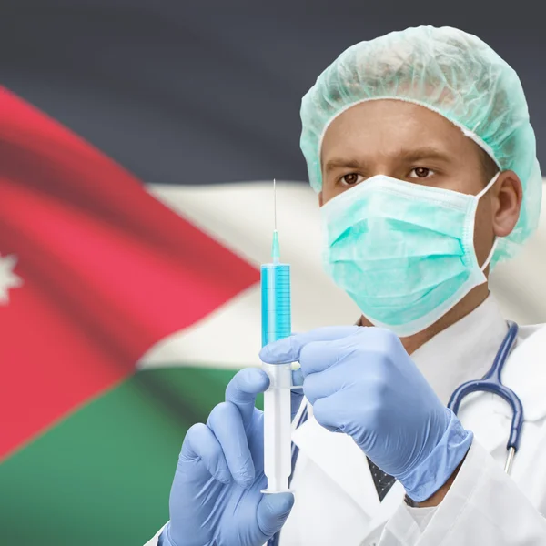 Médico con jeringa en las manos y la bandera de la serie - Jordan —  Fotos de Stock