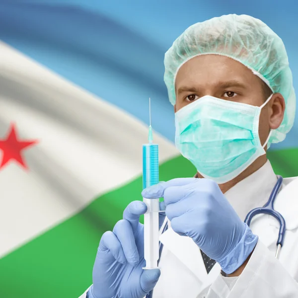 Médecin avec une seringue dans les mains et la série des drapeaux - Djibouti — Photo