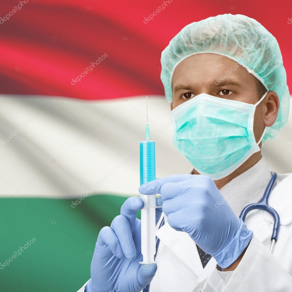 Doctor with syringe in hands and flag series - Hungary