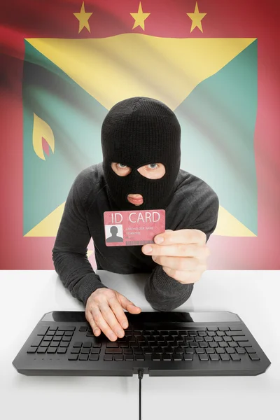 Hacker con bandera en el fondo con tarjeta de identificación en la mano - Granada —  Fotos de Stock