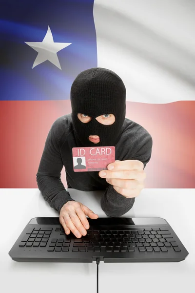 Hacker con bandera en el fondo con DNI en la mano - Chile —  Fotos de Stock