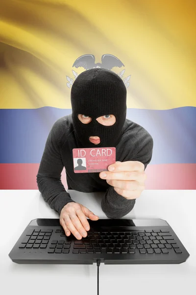 Hacker with flag on background holding ID card in hand - Ecuador — Stock Photo, Image