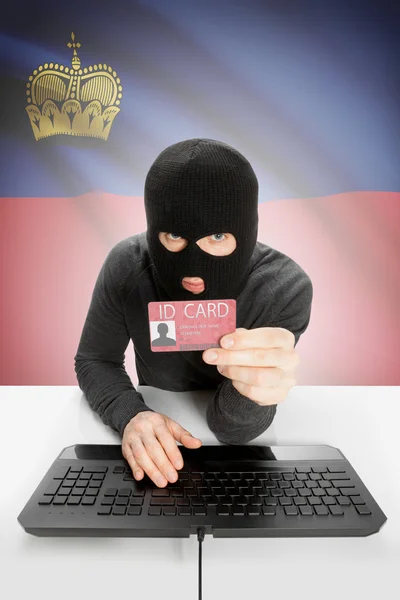 背景上有国旗的黑客手持身份证-列支敦士登 — 图库照片