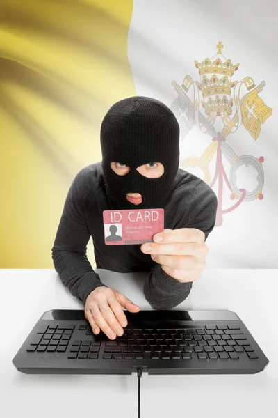 Hacker with flag on background holding ID card in hand - Vatican City State — Stock Photo, Image