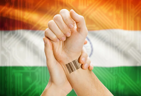 Barcode ID number on wrist and national flag on background - India — Stock Photo, Image