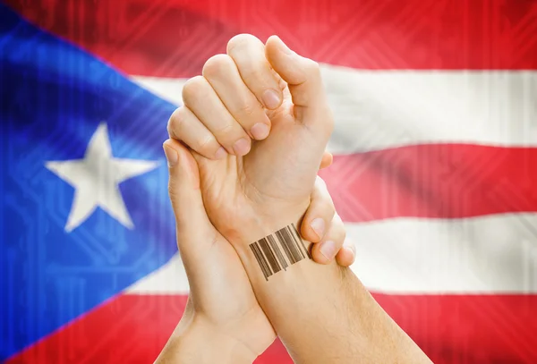 Barcode ID number on wrist and national flag on background - Puerto Rico — Stock Photo, Image