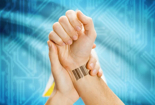 Barcode ID number on wrist and national flag on background - Saint Lucia — Stockfoto