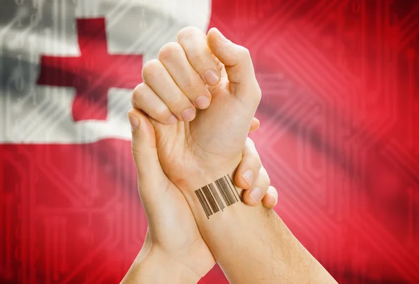 Barcode ID number on wrist and national flag on background - Tonga —  Fotos de Stock