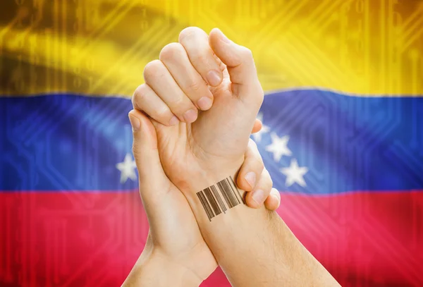 Barcode ID number on wrist and national flag on background - Venezuela —  Fotos de Stock