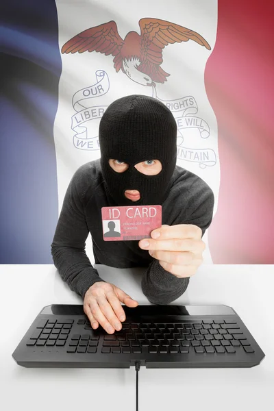 Hacker with USA states flag on background and ID card in hand - Iowa —  Fotos de Stock