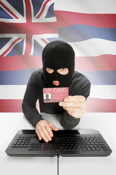 Hacker with USA states flag on background and ID card in hand - Hawaii —  Fotos de Stock
