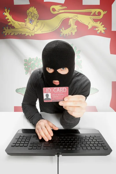 Hacker with Canadian province flag on background holding ID card in hand - Prince Edward Island — Foto Stock