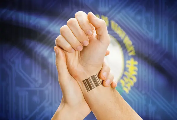 Barcode ID number on wrist and USA states flags on background - Kentucky — Stok fotoğraf