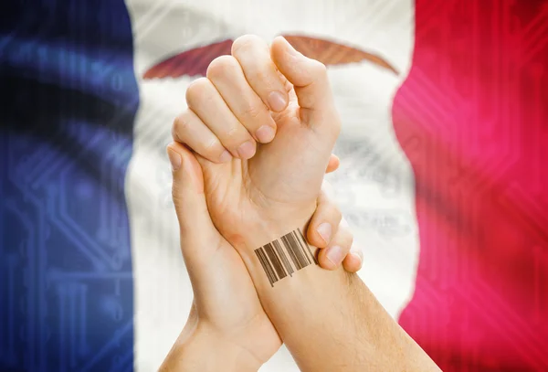 Barcode ID number on wrist and USA states flags on background - Iowa — Stockfoto