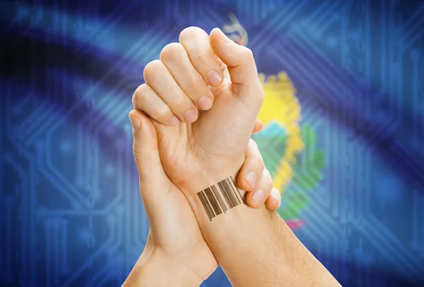 Barcode ID number on wrist and USA states flags on background - Vermont — Stock Photo, Image