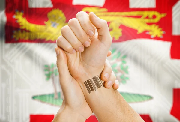 Barcode ID number on wrist with Canadian province flag on background - Prince Edward Island — Stock Photo, Image