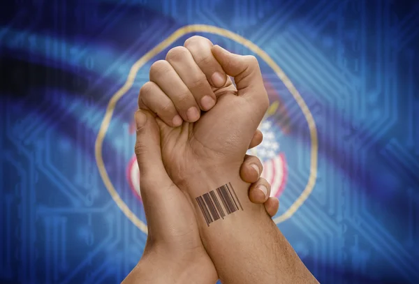 Barcode ID number on wrist of dark skinned person and USA states flags on background - Utah — Stok fotoğraf