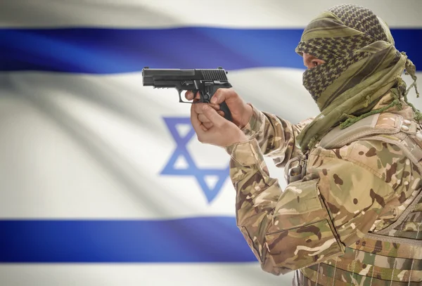 Male in muslim keffiyeh with gun in hand and national flag on background - Israel — стокове фото