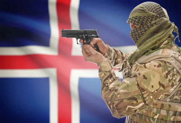 Male in muslim keffiyeh with gun in hand and national flag on background - Iceland — Stok fotoğraf